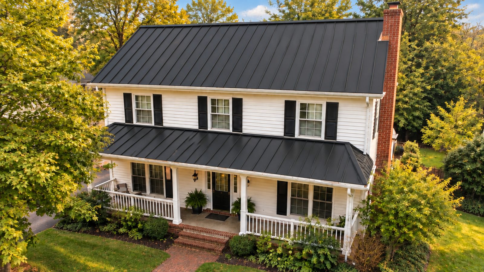 House with black standing seam metal roof